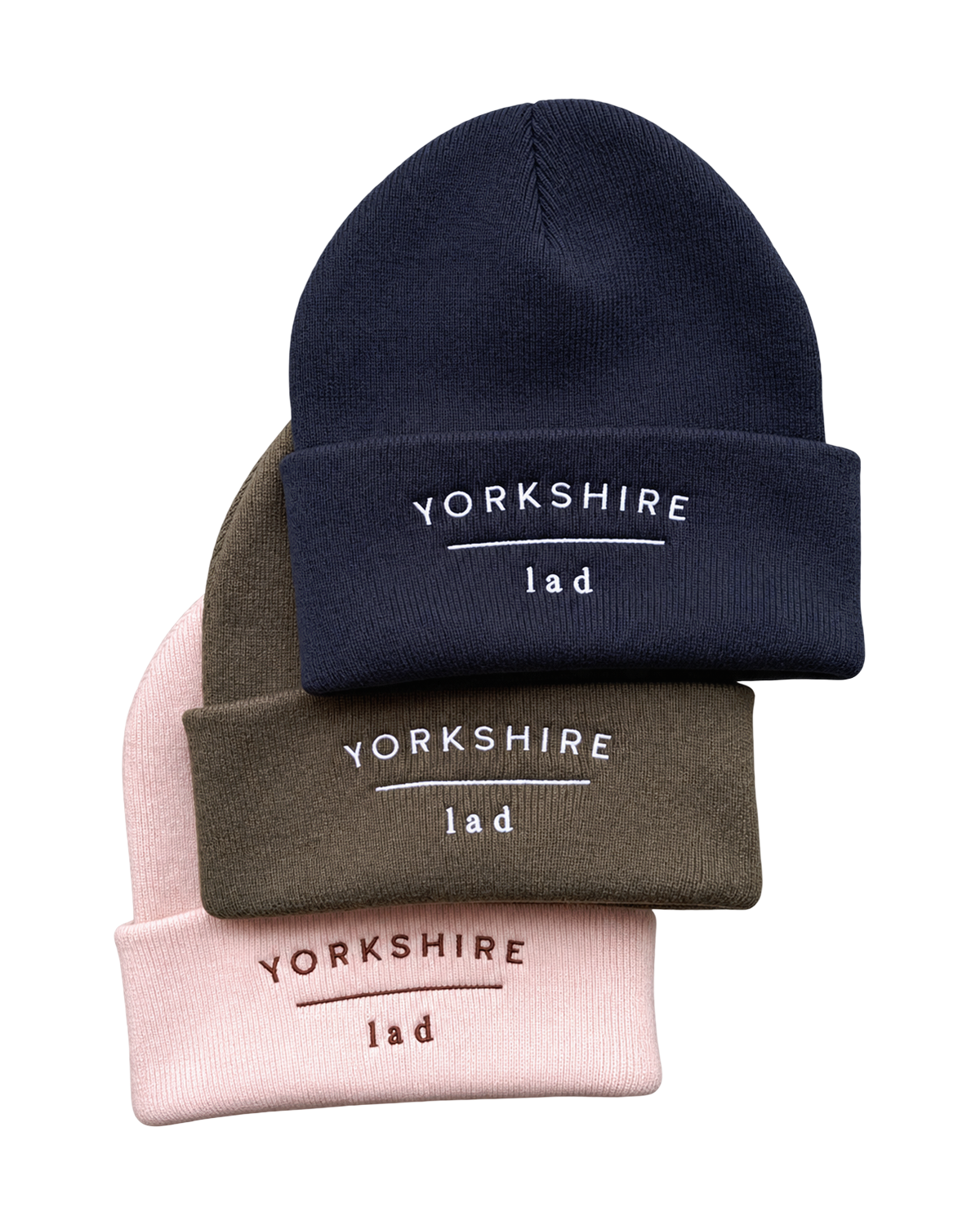 LighthouseLane cuffed beanies in navy, olive, and pink with Yorkshire Lad embroidery on the front