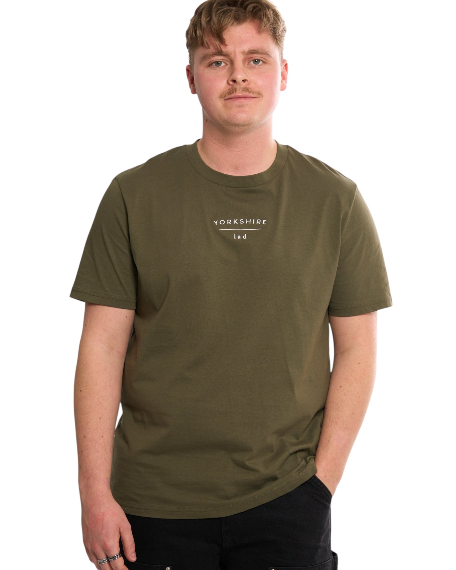 Male model wearing a Yorkshire lad dark navy blue t-shirt, with white embroidered slogan / logo. 100% organic cotton premium heavy thick quality t-shirt top. Minimalist design. Northern clothing. 