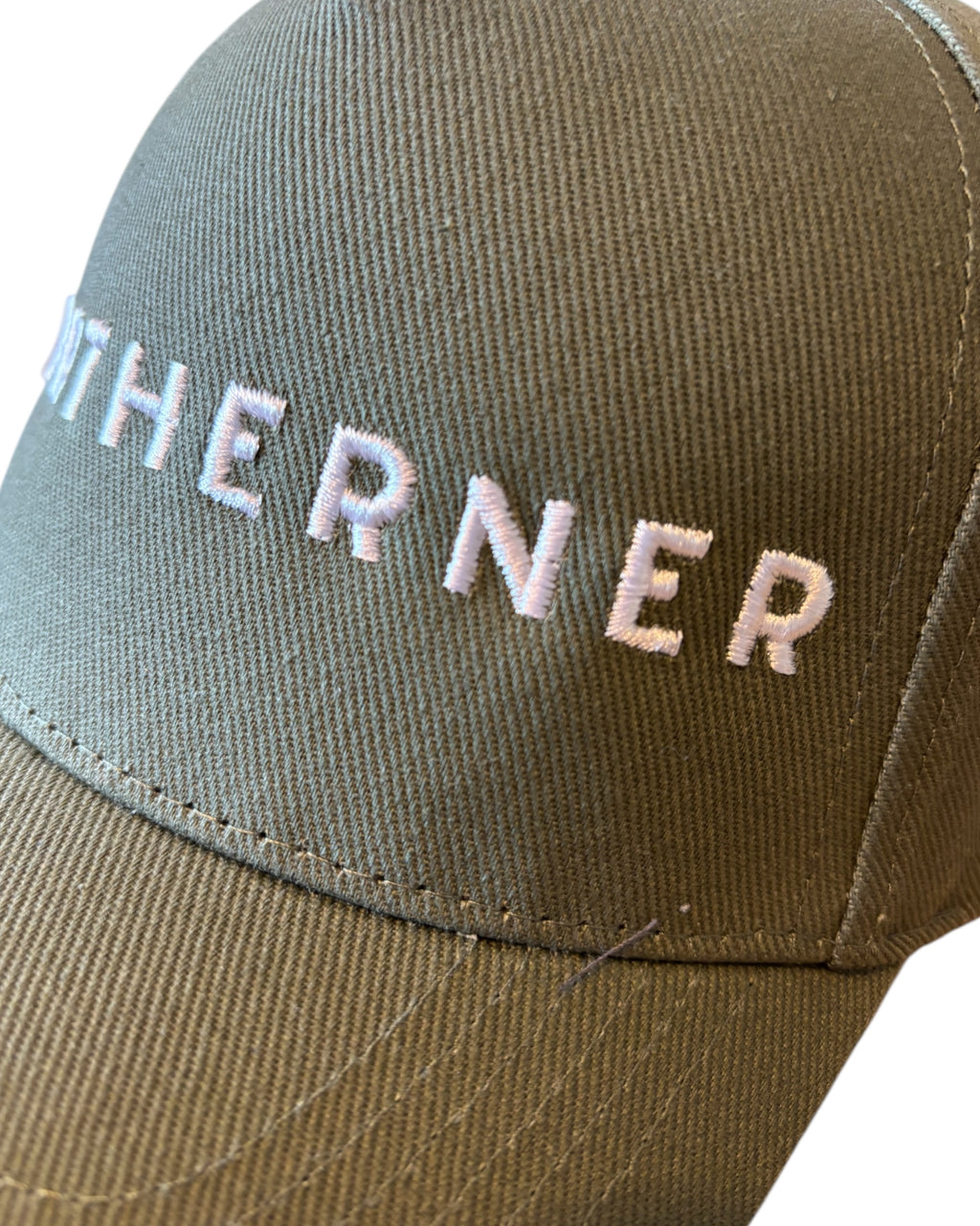 Close up of stitching on dad cap with Northerner embroidery / embroidered slogan logo. Hat for men and women - unisex. Great gift for someone from Yorkshire or Lancashire.