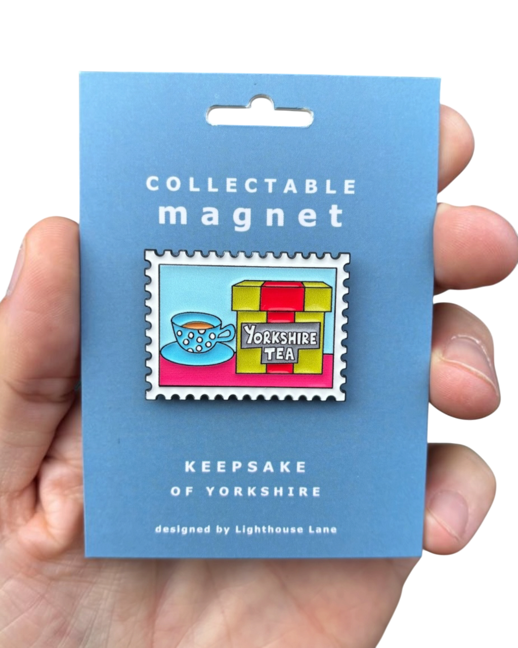 LighthouseLane Yorkshire Tea magnet featuring stamp-style artwork of a tea cup and box on a blue backing card