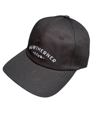 Close up shot of the stitching detail on a black neutral dad cap with white Northerner embroidery / embroidered sports club type slogan logo. Hat for men and women - unisex. Great gift for someone from Yorkshire or Lancashire.