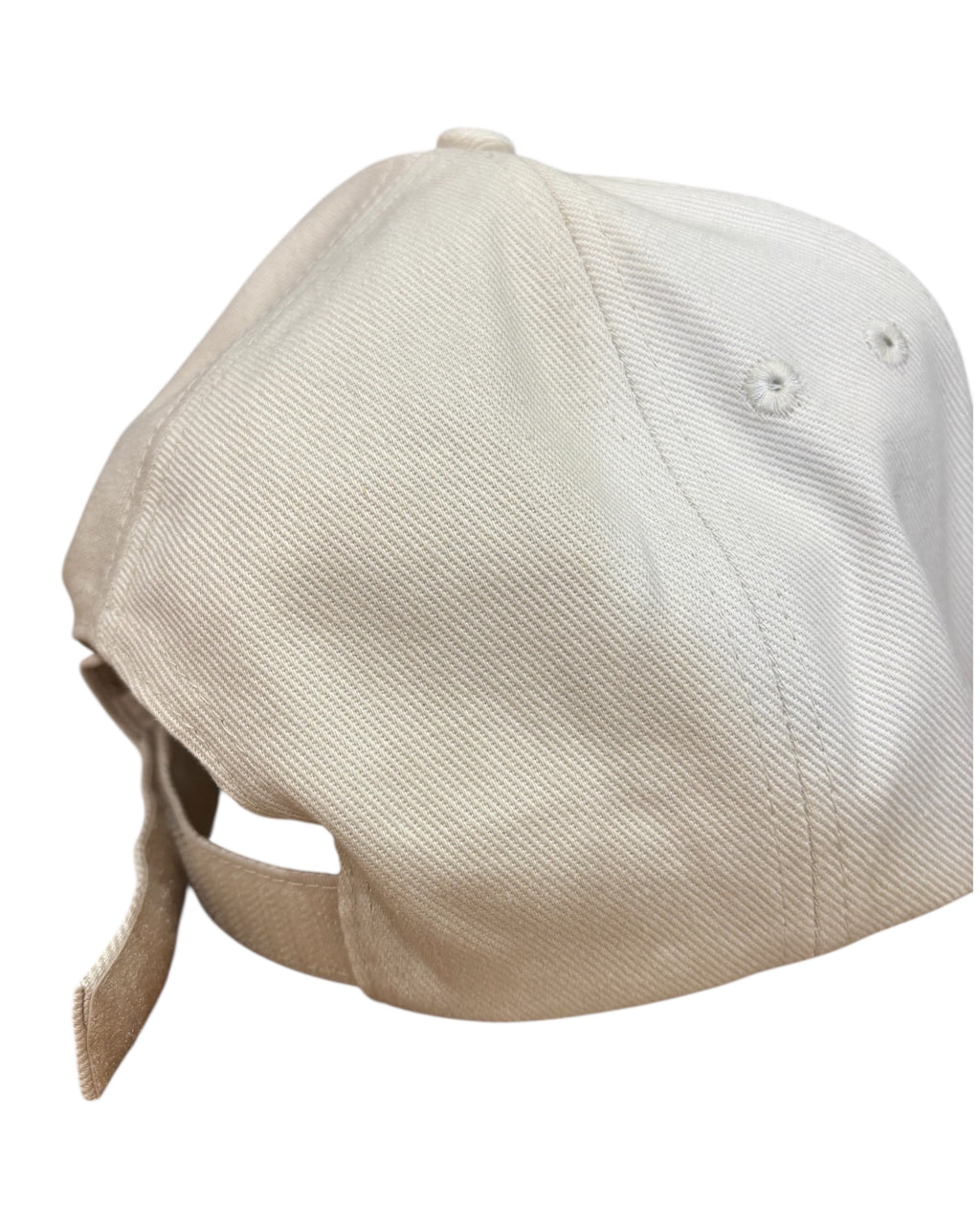 Close up back view of the Velcro fastener strap on a neutral dad cap with minimalist funny Yorkshire / Northern / Lancashire slogan / logo in coffee embroidery/ embroidered. This hat would be a perfect gift for a Northerner. Suitable for men and women, it's unisex and great quality. It'll be reyt Yorkshire dialect gift