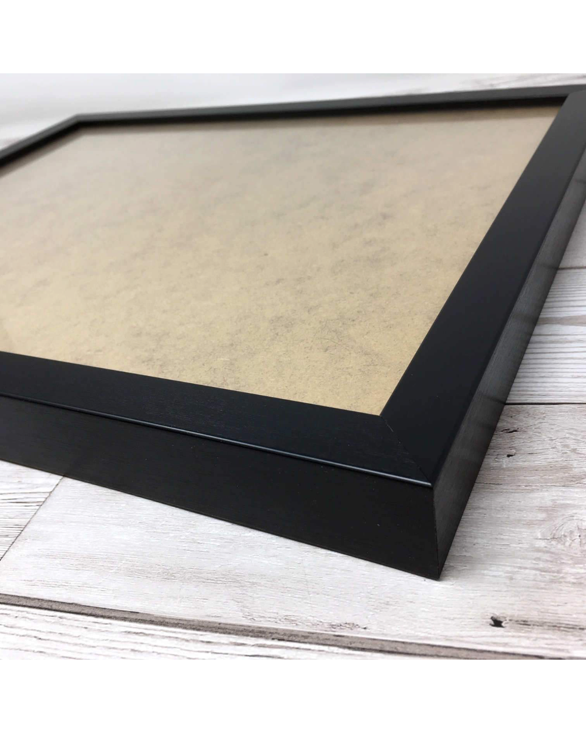 LighthouseLane Scottish optician eyetest print in a black handmade Polcore frame on a wooden surface
