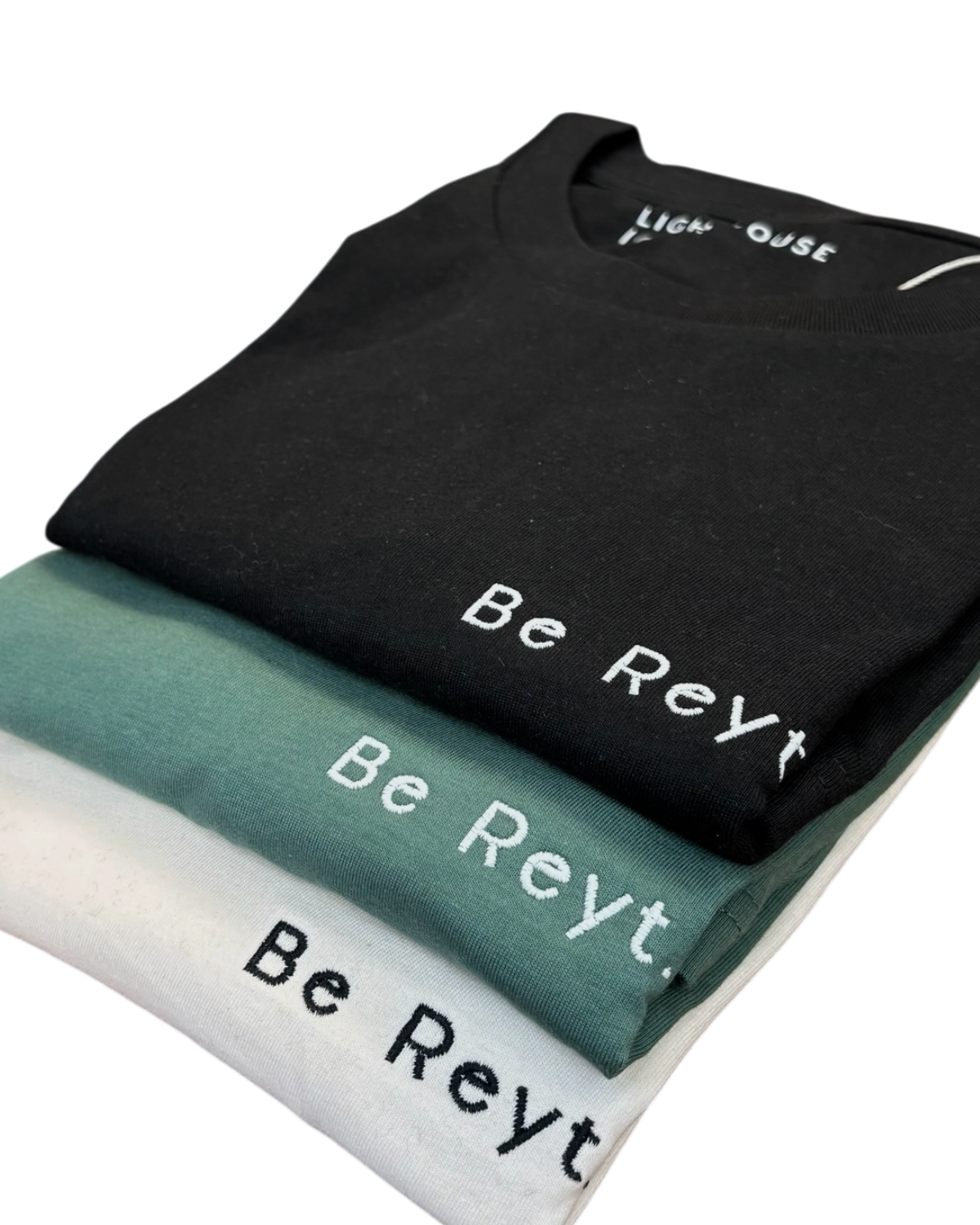 LighthouseLane organic cotton t-shirts in black, green, and white with Be Reyt Yorkshire slogan embroidery