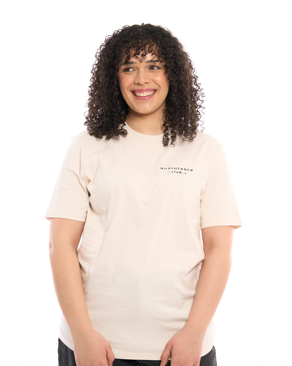 LighthouseLane unisex organic cotton t-shirt in beige with Northerner Club embroidery worn by a smiling woman