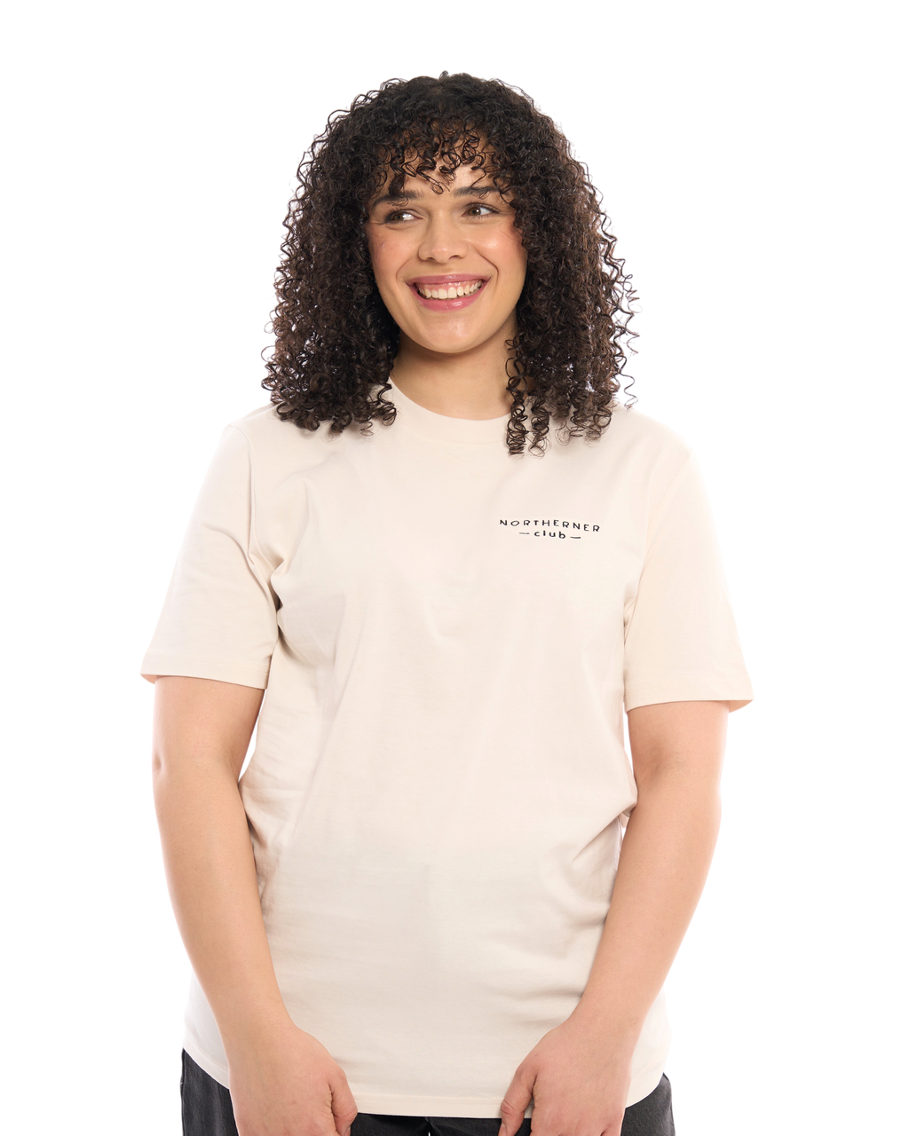 LighthouseLane unisex organic cotton t-shirt in beige with Northerner Club embroidery worn by a smiling woman