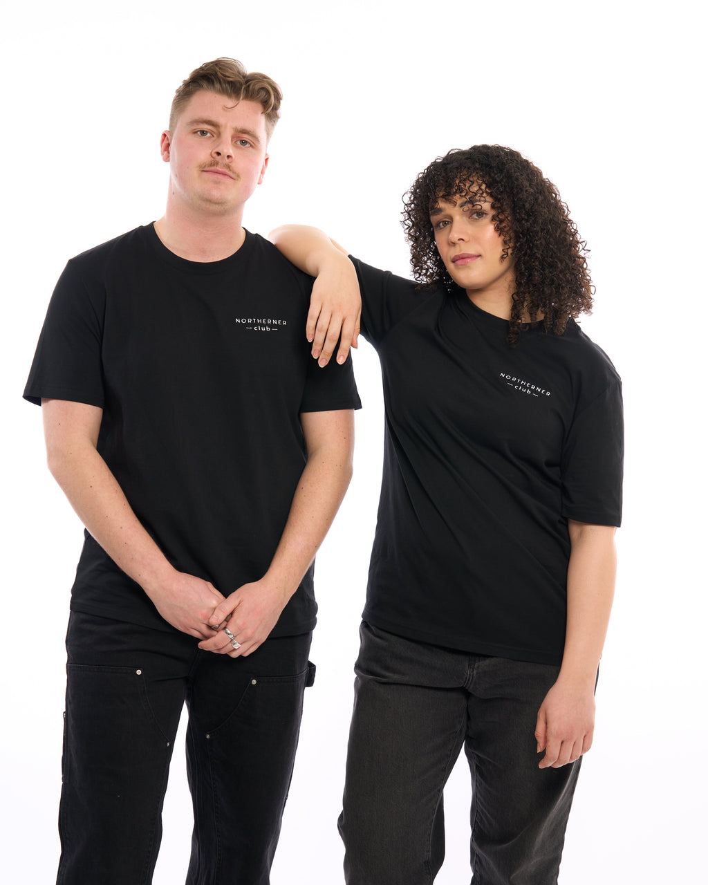 LighthouseLane unisex black organic cotton t-shirts with Northerner Club embroidered logo worn by a man and woman.