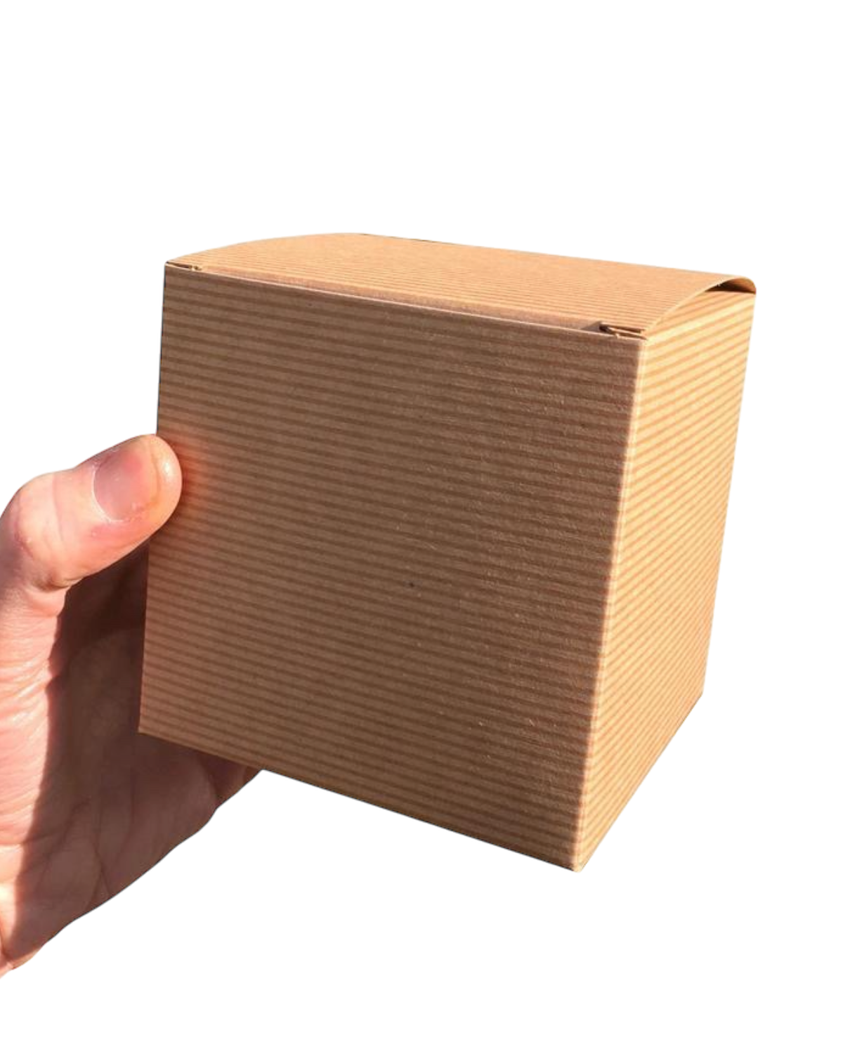 LighthouseLane brown corrugated cardboard gift box held in a hand, perfect for packaging a ceramic mug.