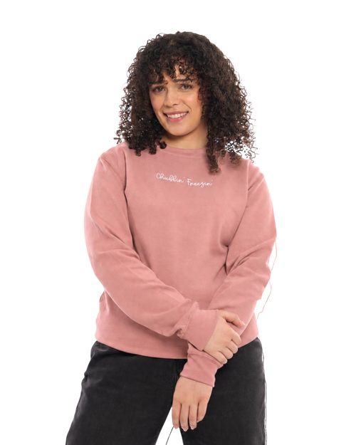 LighthouseLane unisex dusty pink sweatshirt with Chuffin Freezin embroidered slogan worn by a woman with curly hair