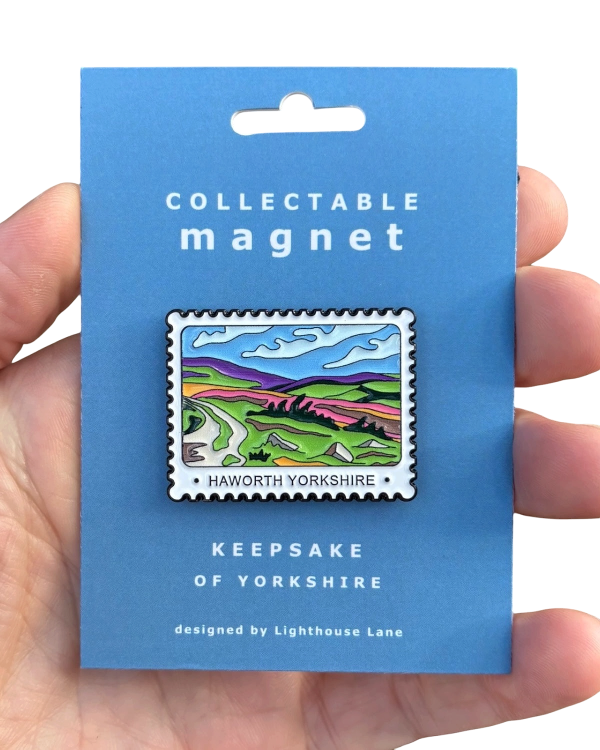 LighthouseLane Haworth Yorkshire postage-stamp style magnet featuring a colorful landscape design on a blue card