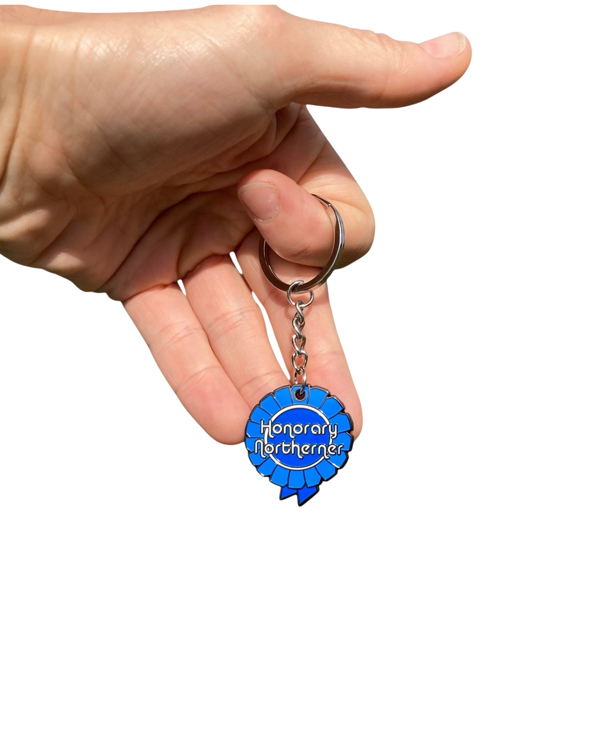 LighthouseLane Honorary Northerner blue enamel rosette keychain held in a hand against a white background