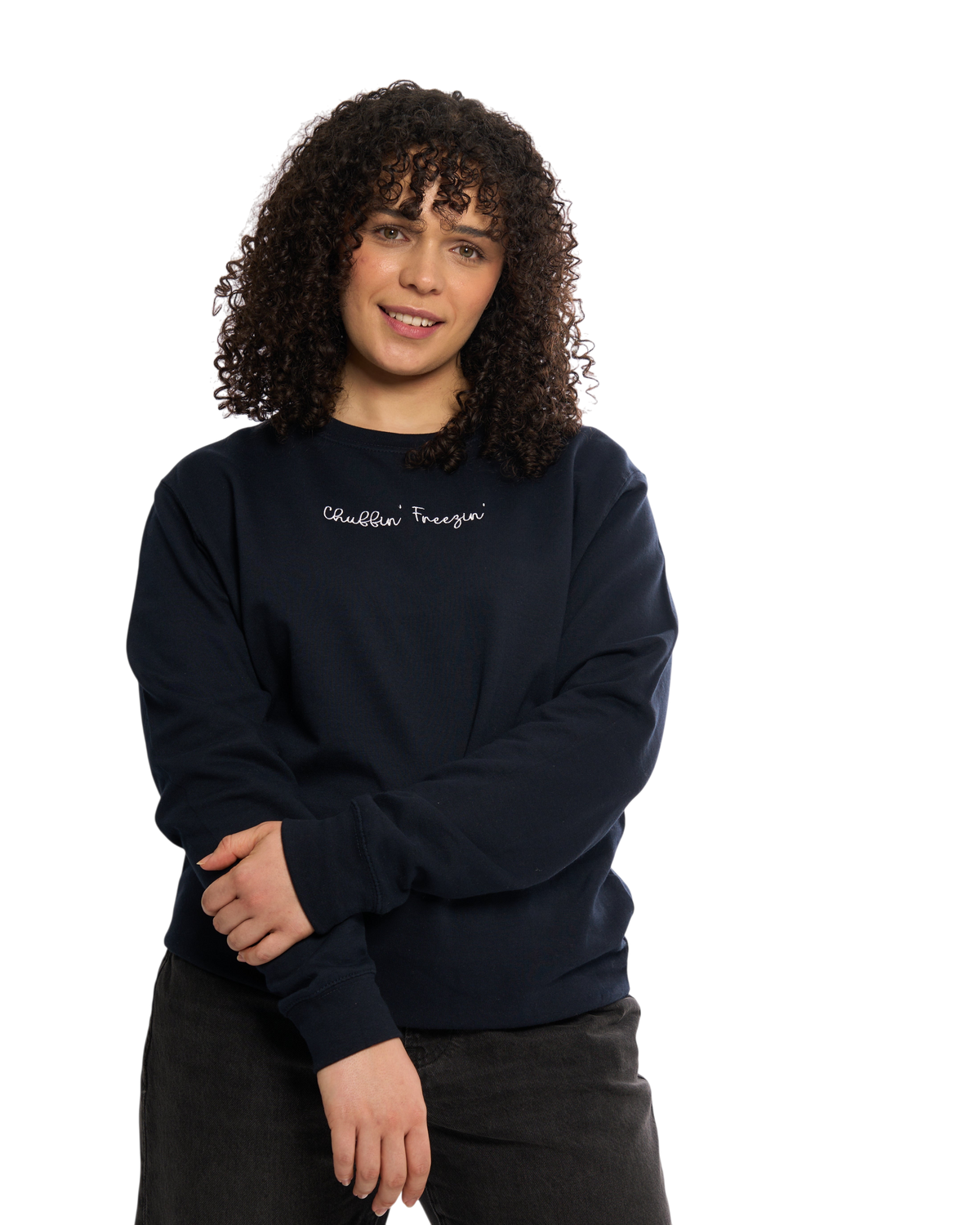 LighthouseLane navy blue unisex sweatshirt with Chuffin Freezin embroidered slogan worn by a woman with curly hair