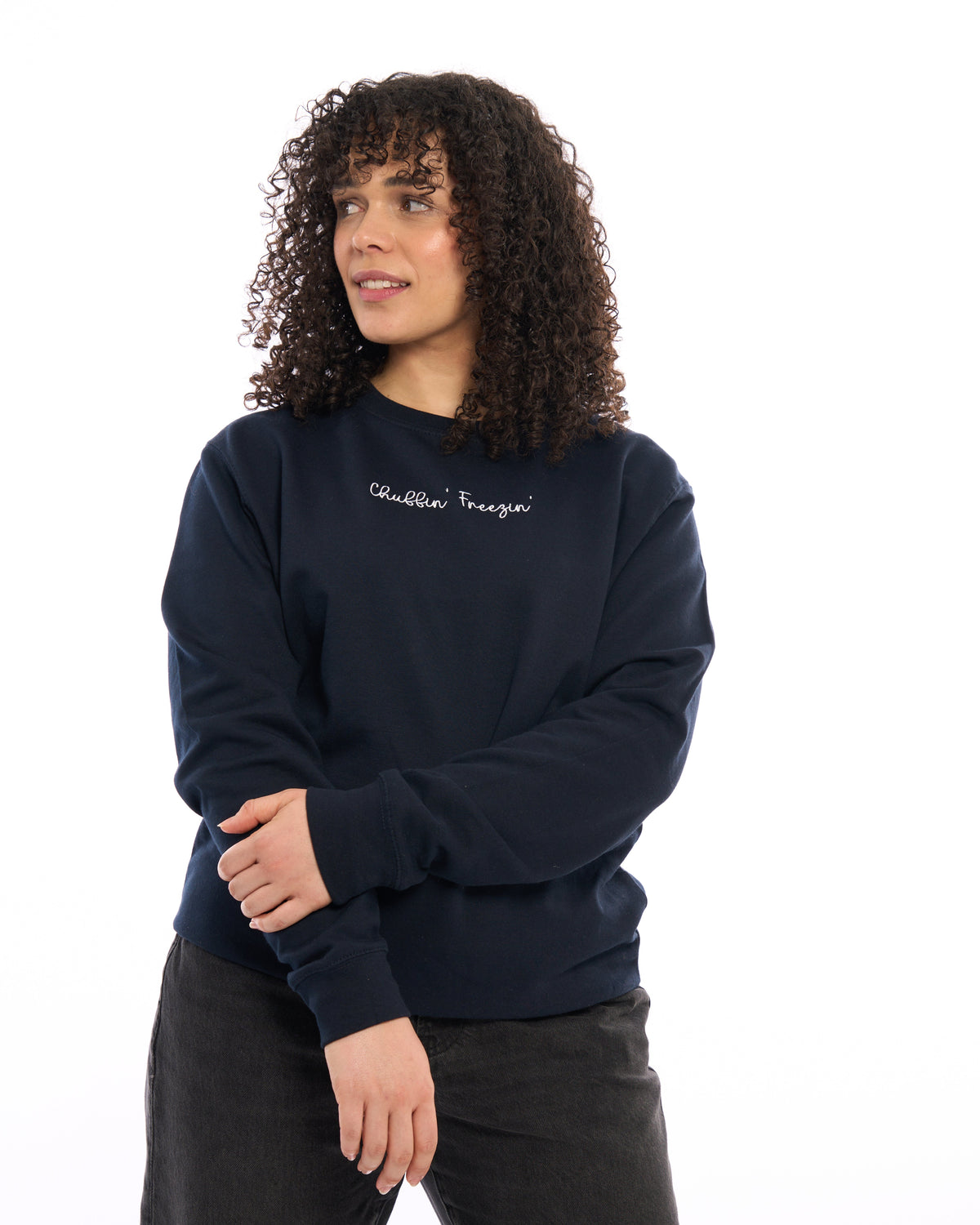 LighthouseLane navy blue unisex sweatshirt with Chuffin Freezin embroidered slogan worn by a woman with curly hair