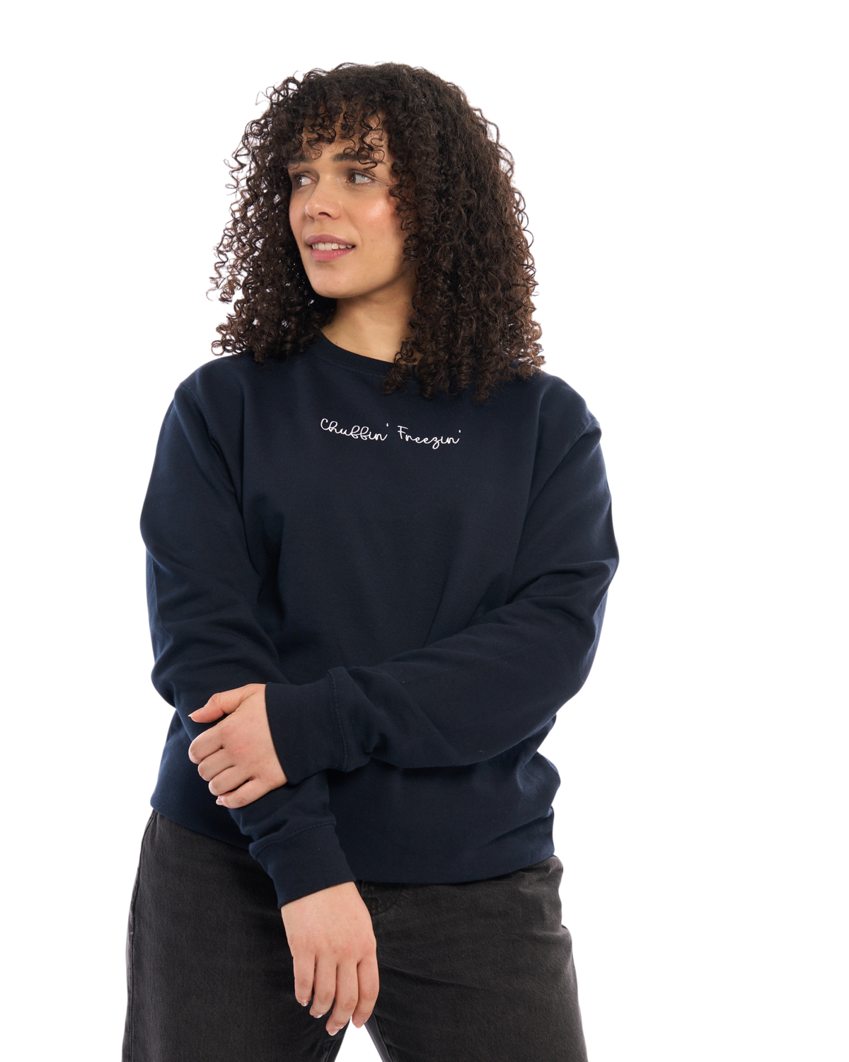 LighthouseLane navy blue unisex sweatshirt with Chuffin Freezin embroidered slogan worn by a woman with curly hair