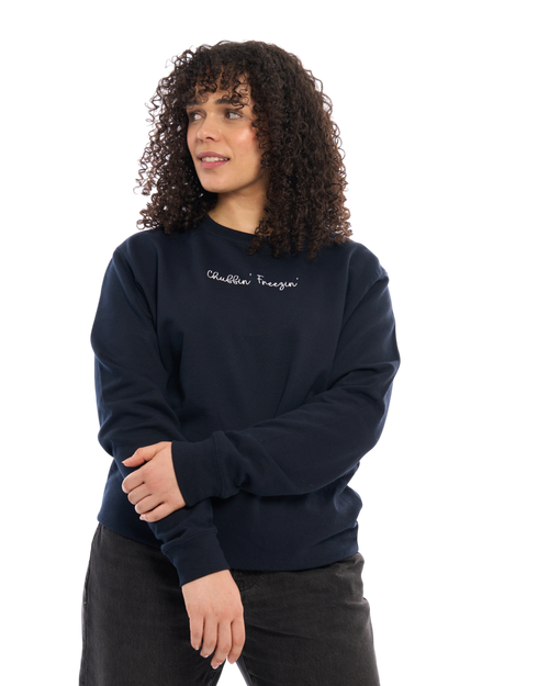 LighthouseLane navy blue unisex sweatshirt with Chuffin Freezin embroidered slogan worn by a woman with curly hair