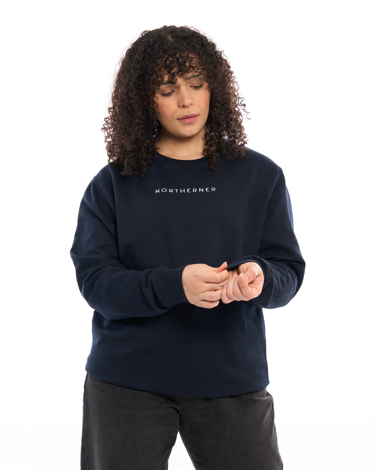 Model wearing a navy blue LighthouseLane Northerner embroidered unisex sweatshirt with a relaxed fit.