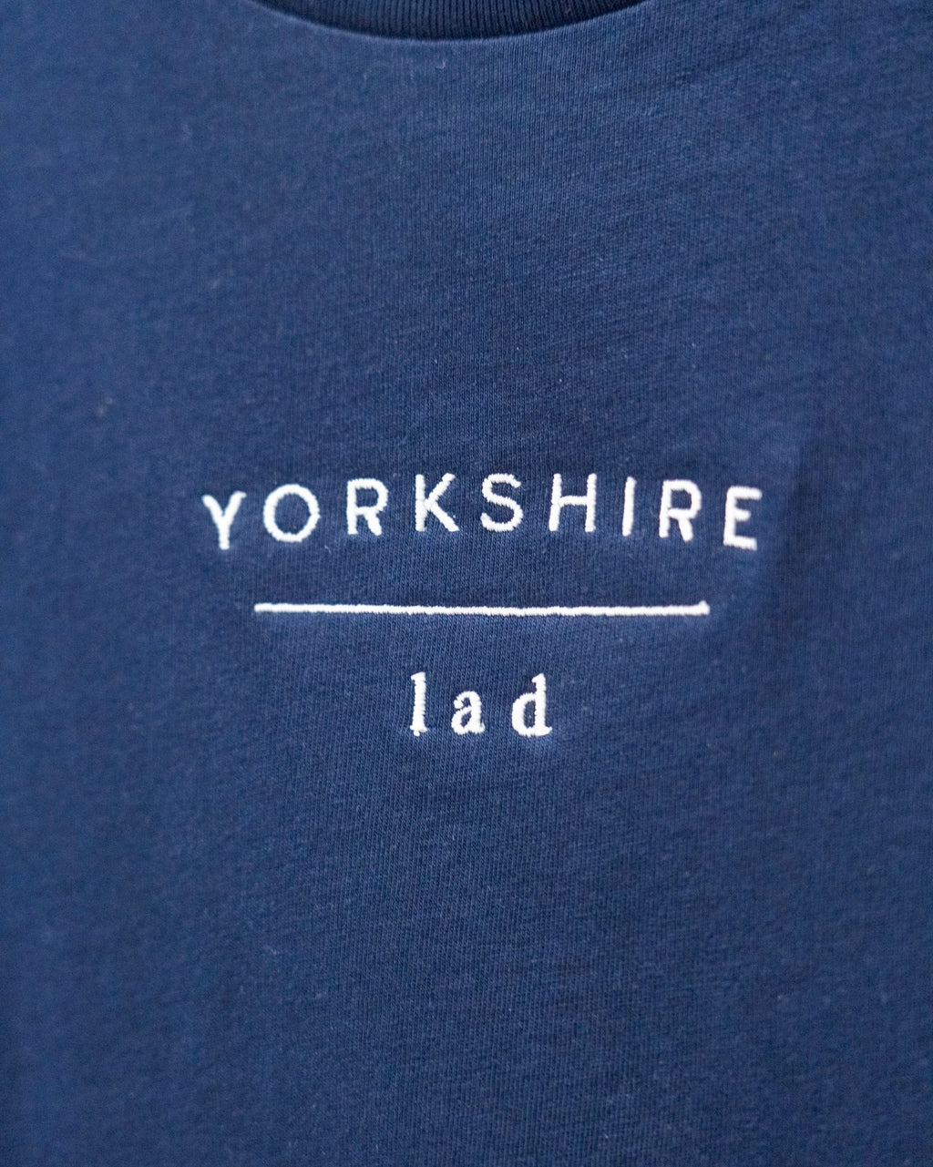 LighthouseLane navy organic cotton t-shirt with white Yorkshire Lad slogan embroidery