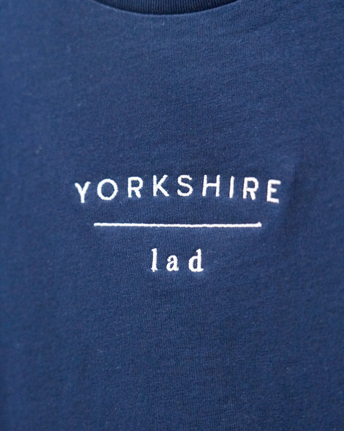 LighthouseLane navy organic cotton t-shirt with white Yorkshire Lad slogan embroidery