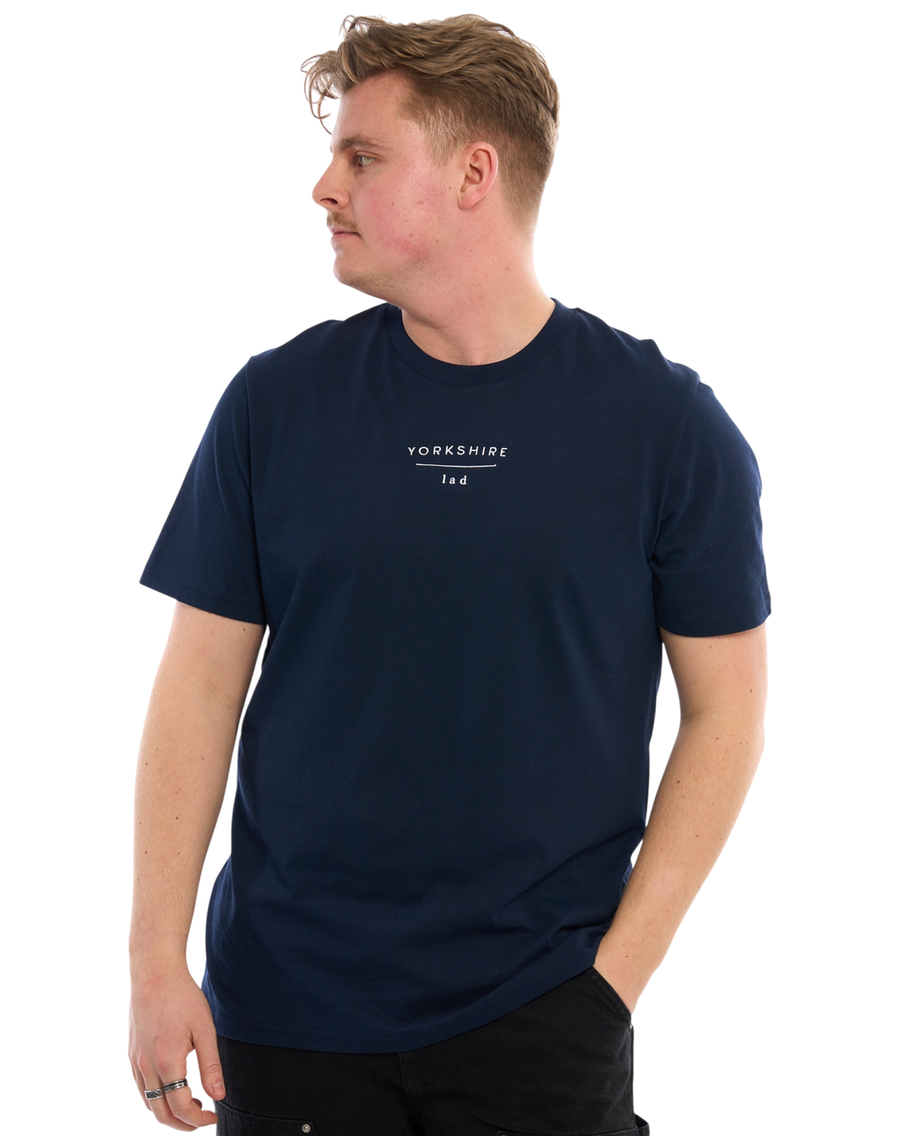 LighthouseLane navy blue organic cotton unisex T-shirt with Yorkshire Lad embroidery worn by a man looking sideways