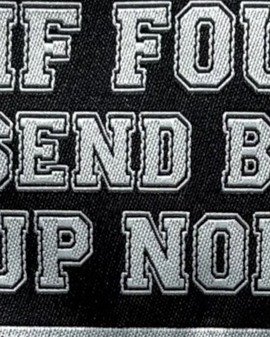 LighthouseLane embroidered iron-on patch with If Found Send Back Up North text in silver stitching on black fabric