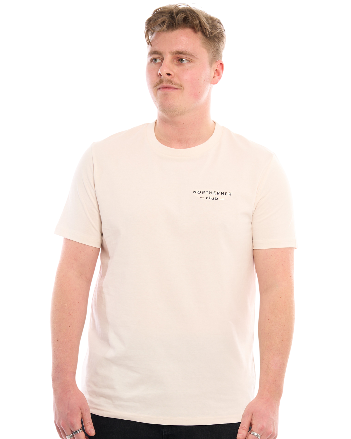 LighthouseLane Northerner Club organic cotton t-shirt in cream with black chest embroidery worn by a male model