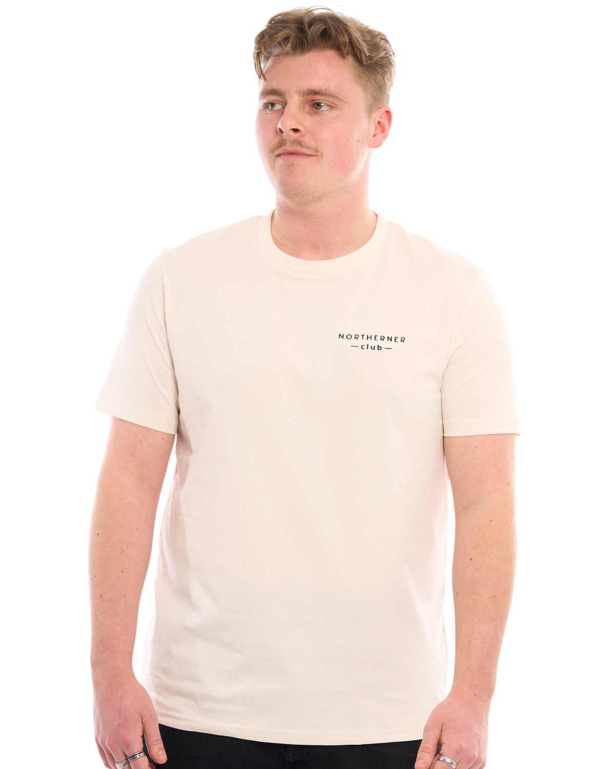 LighthouseLane Northerner Club organic cotton t-shirt in cream with black chest embroidery worn by a male model
