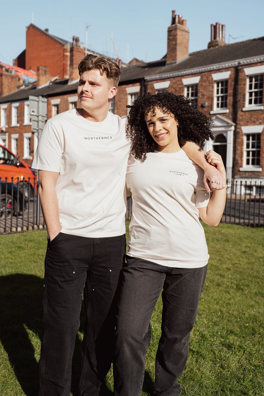 LighthouseLane unisex organic cotton t-shirts with Northerner Club embroidery worn by a man and woman outdoors.