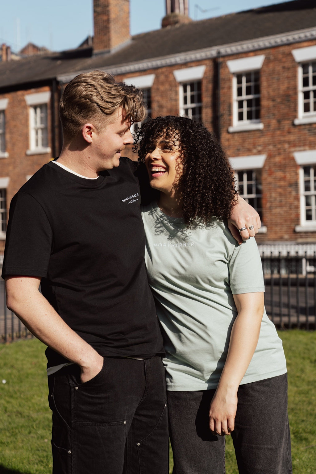 LighthouseLane unisex organic cotton t-shirts with Northerner Club embroidery worn by a couple outdoors