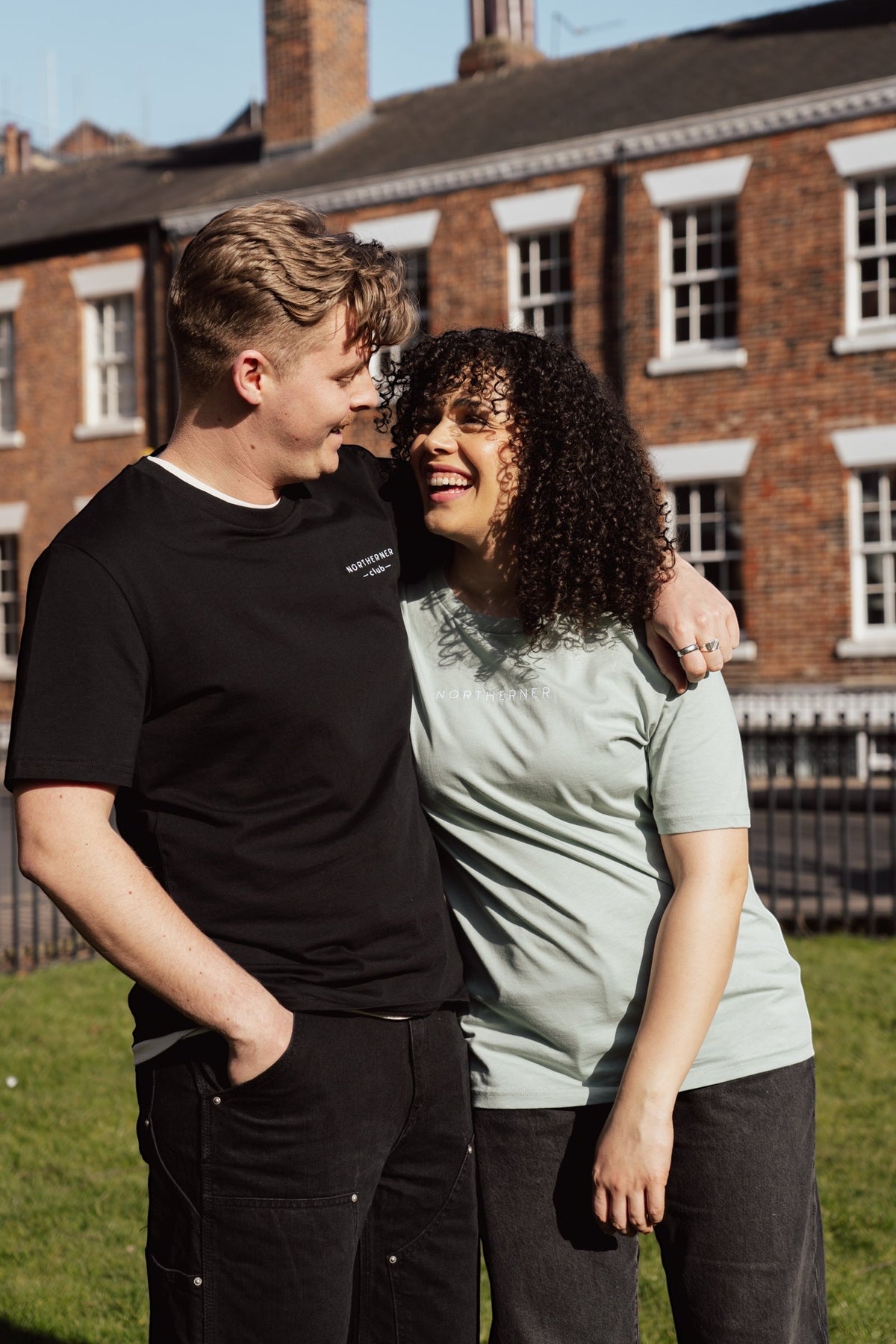 LighthouseLane unisex organic cotton t-shirts with Northerner Club embroidery worn by a couple outdoors