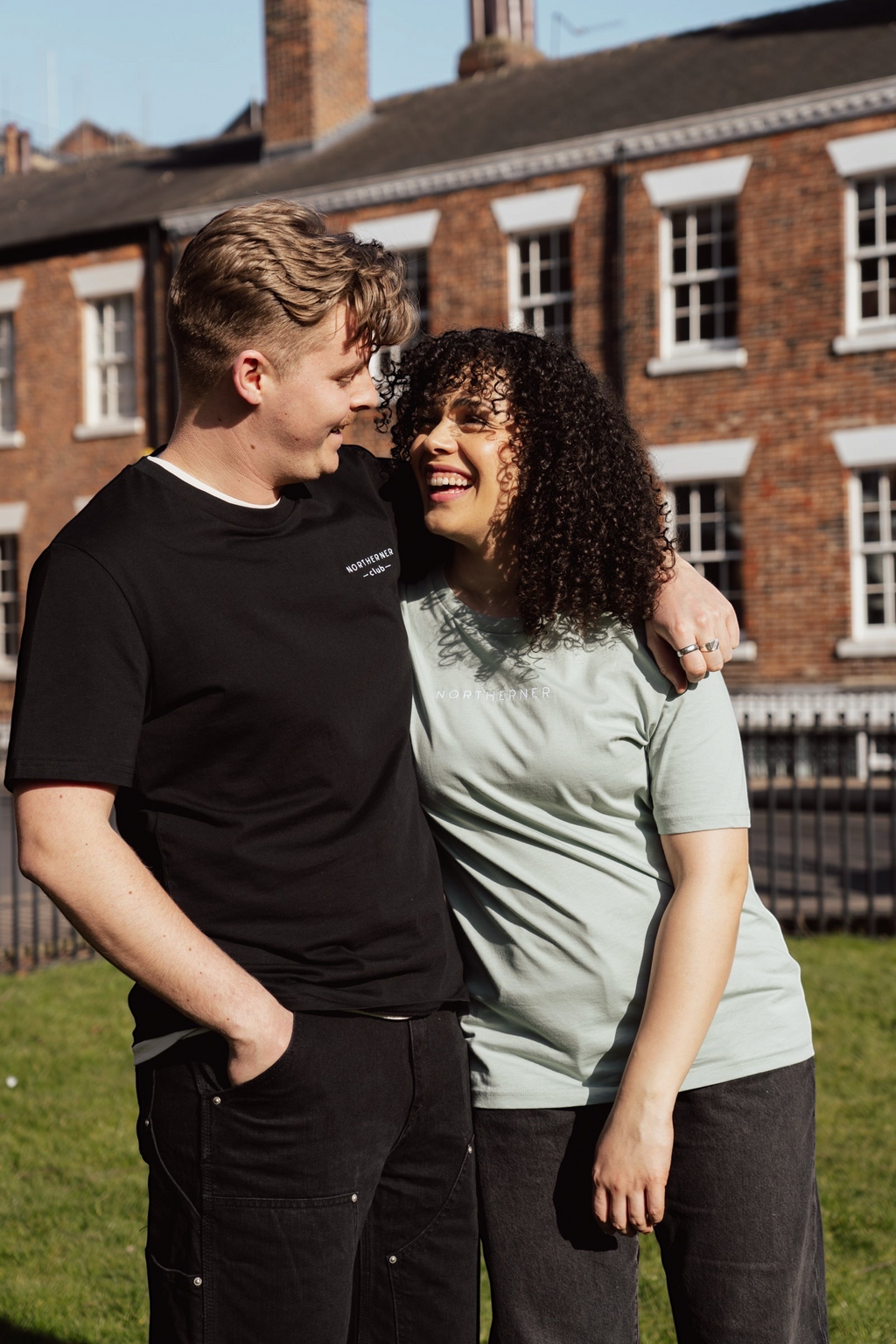 LighthouseLane unisex organic cotton t-shirts with Northerner Club embroidery worn by a couple outdoors