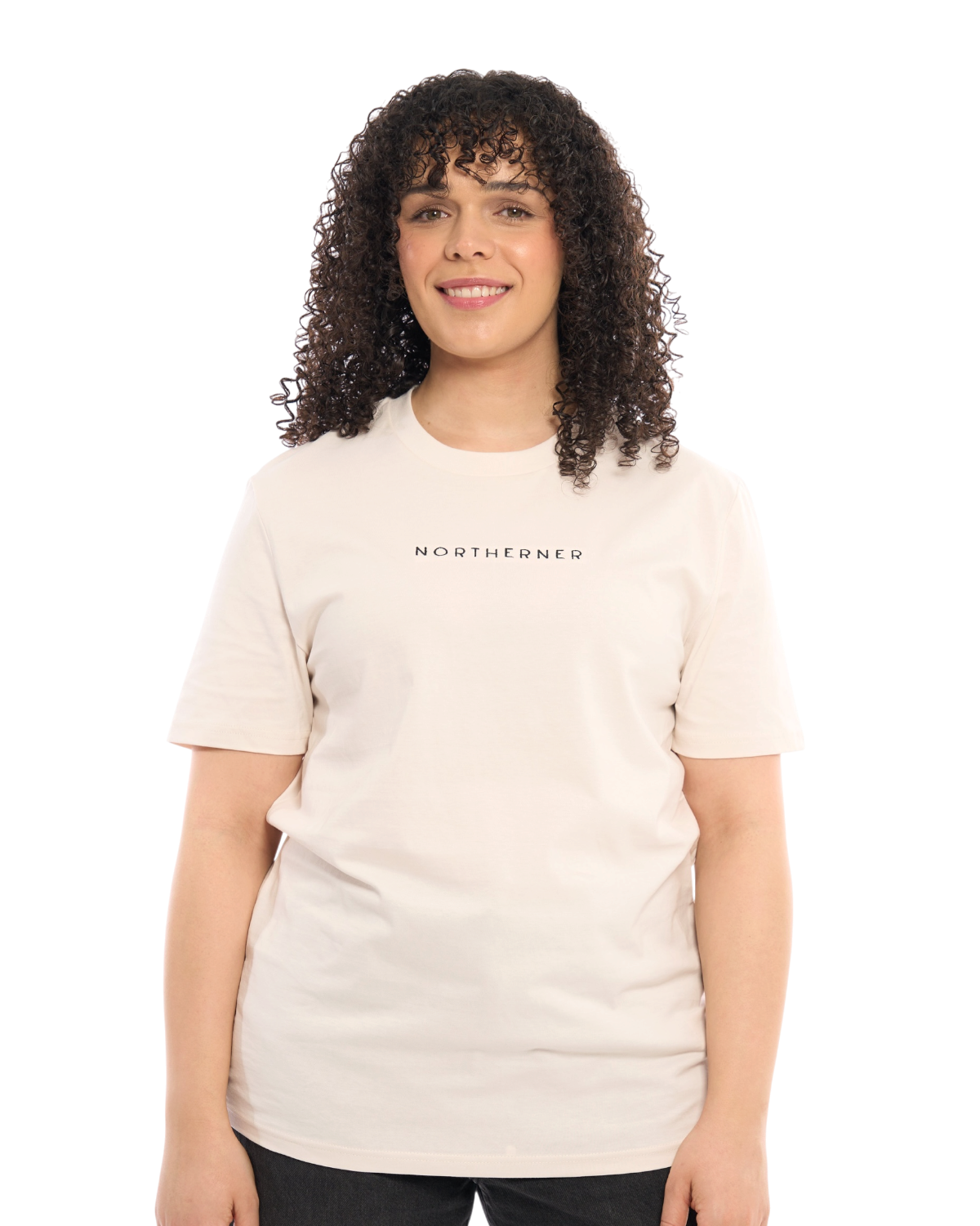 LighthouseLane unisex organic cotton t-shirt in cream with Northerner embroidered slogan worn by a smiling woman