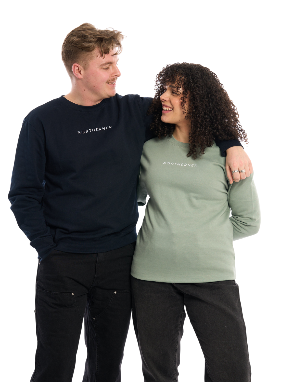 LighthouseLane unisex Northerner embroidered sweatshirts in navy and sage green worn by a man and woman.