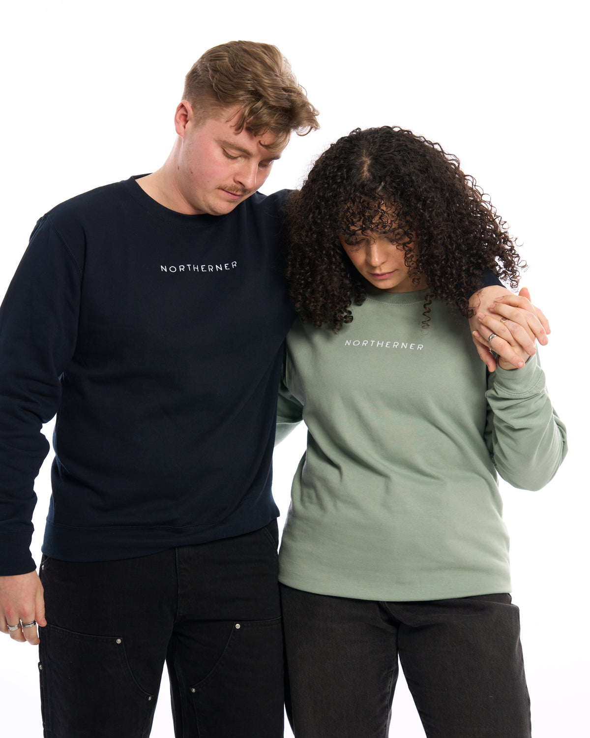 LighthouseLane unisex Northerner embroidered sweatshirts in navy and sage green worn by a couple