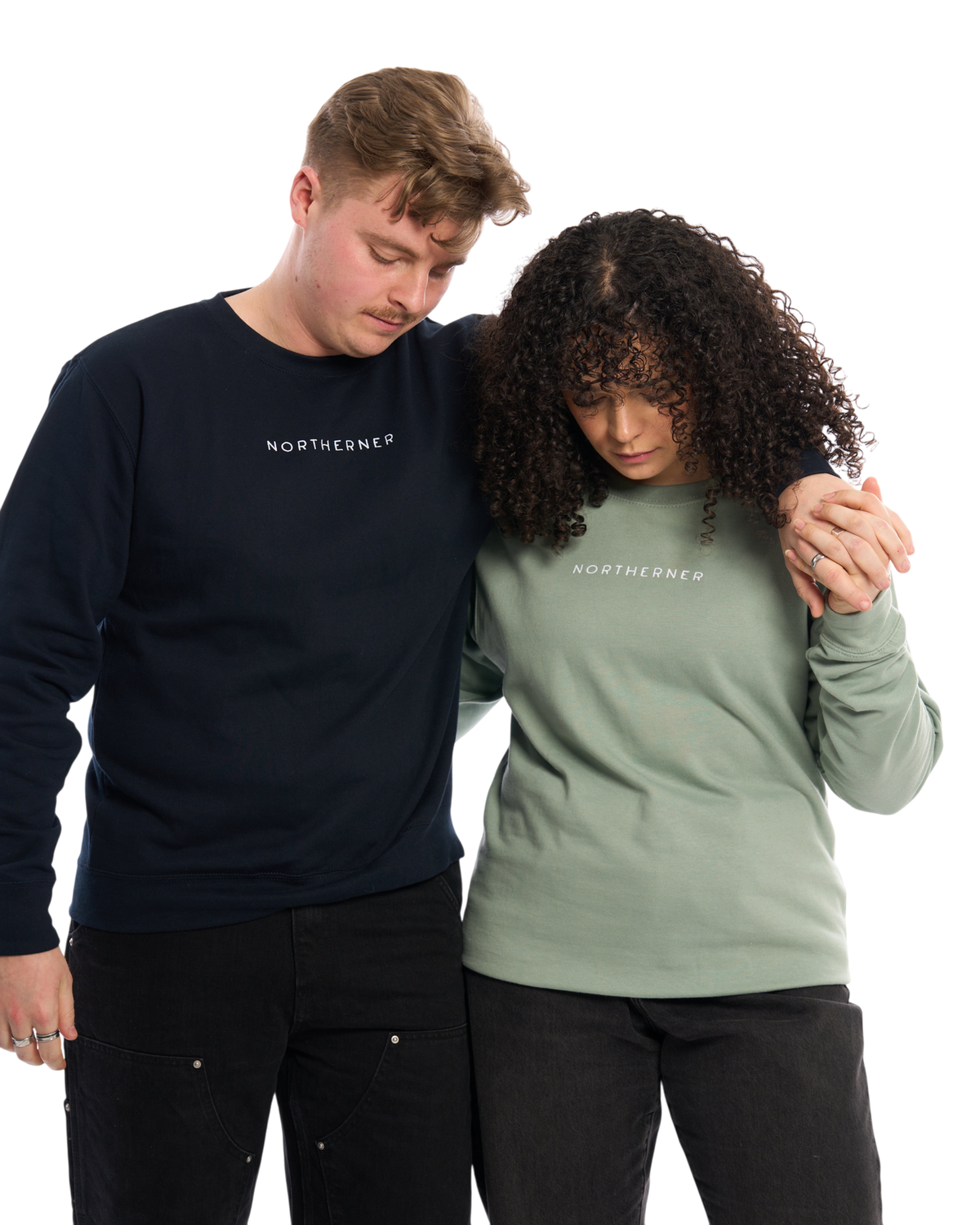 LighthouseLane unisex Northerner embroidered sweatshirts in navy and sage green worn by a couple