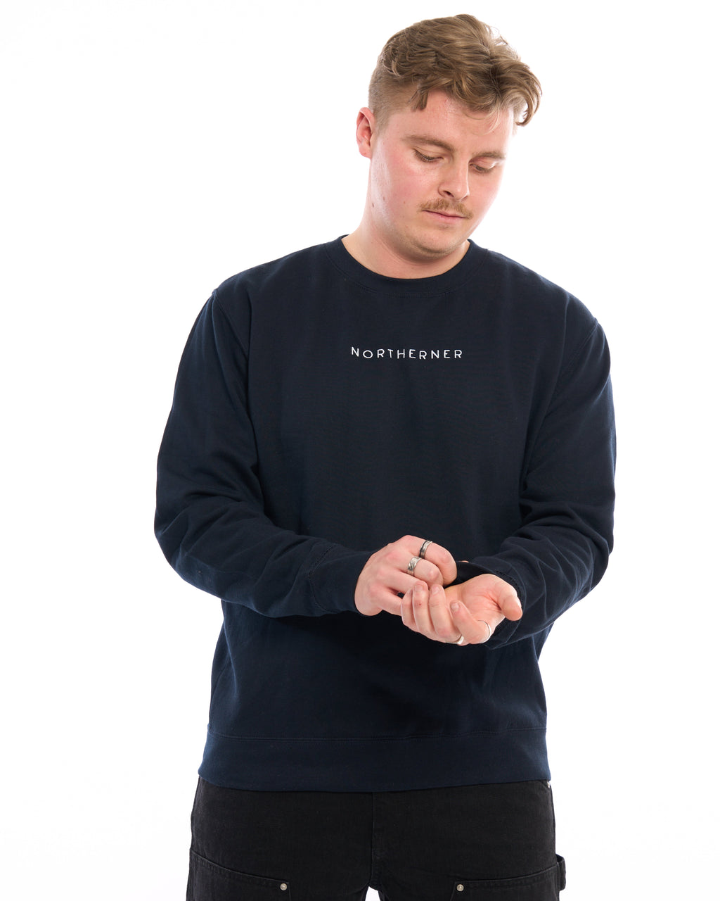 LighthouseLane navy blue unisex sweatshirt with Northerner embroidered text worn by a man on a white background.