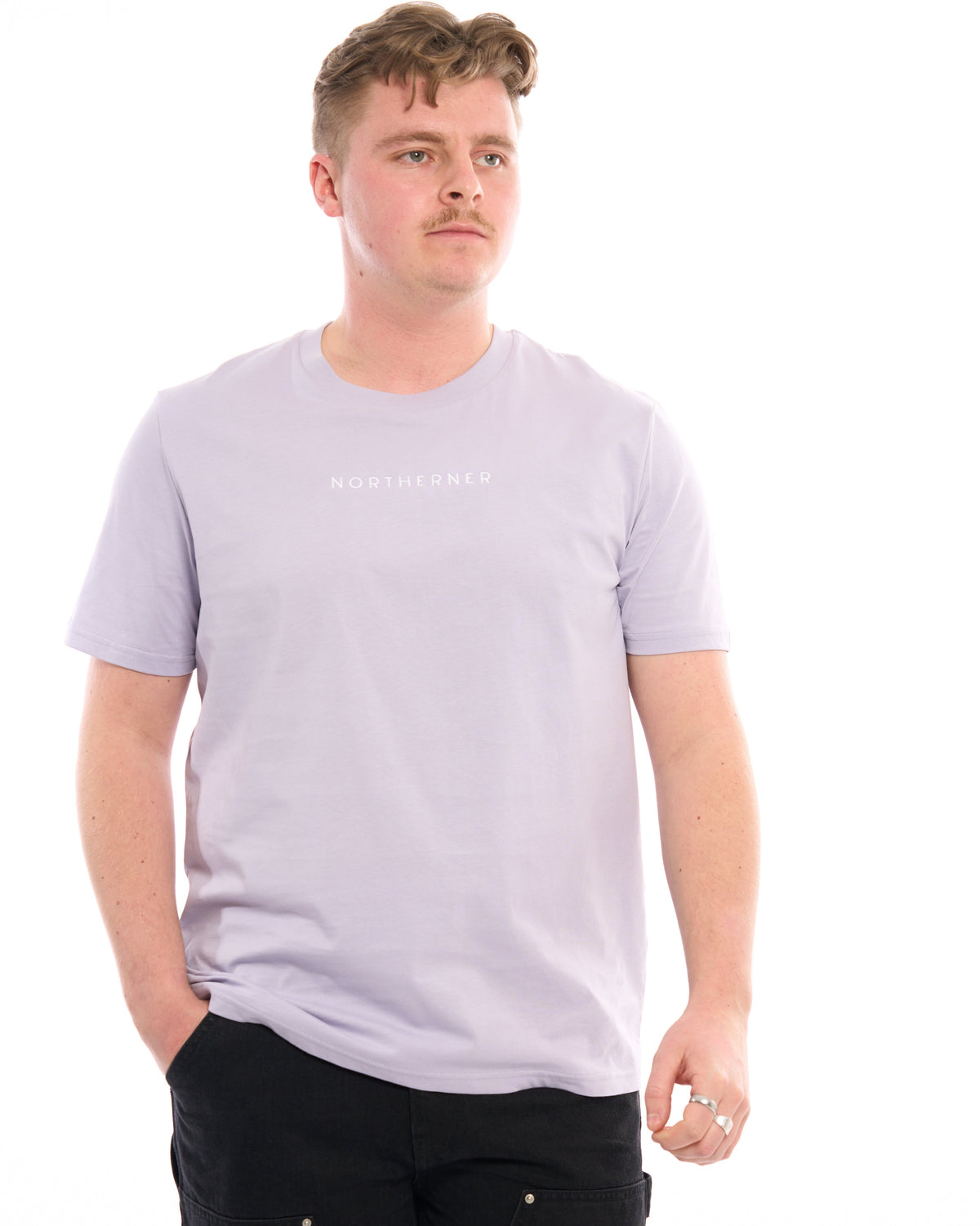 LighthouseLane Northerner unisex organic cotton t-shirt in light purple with chest embroidery on a male model