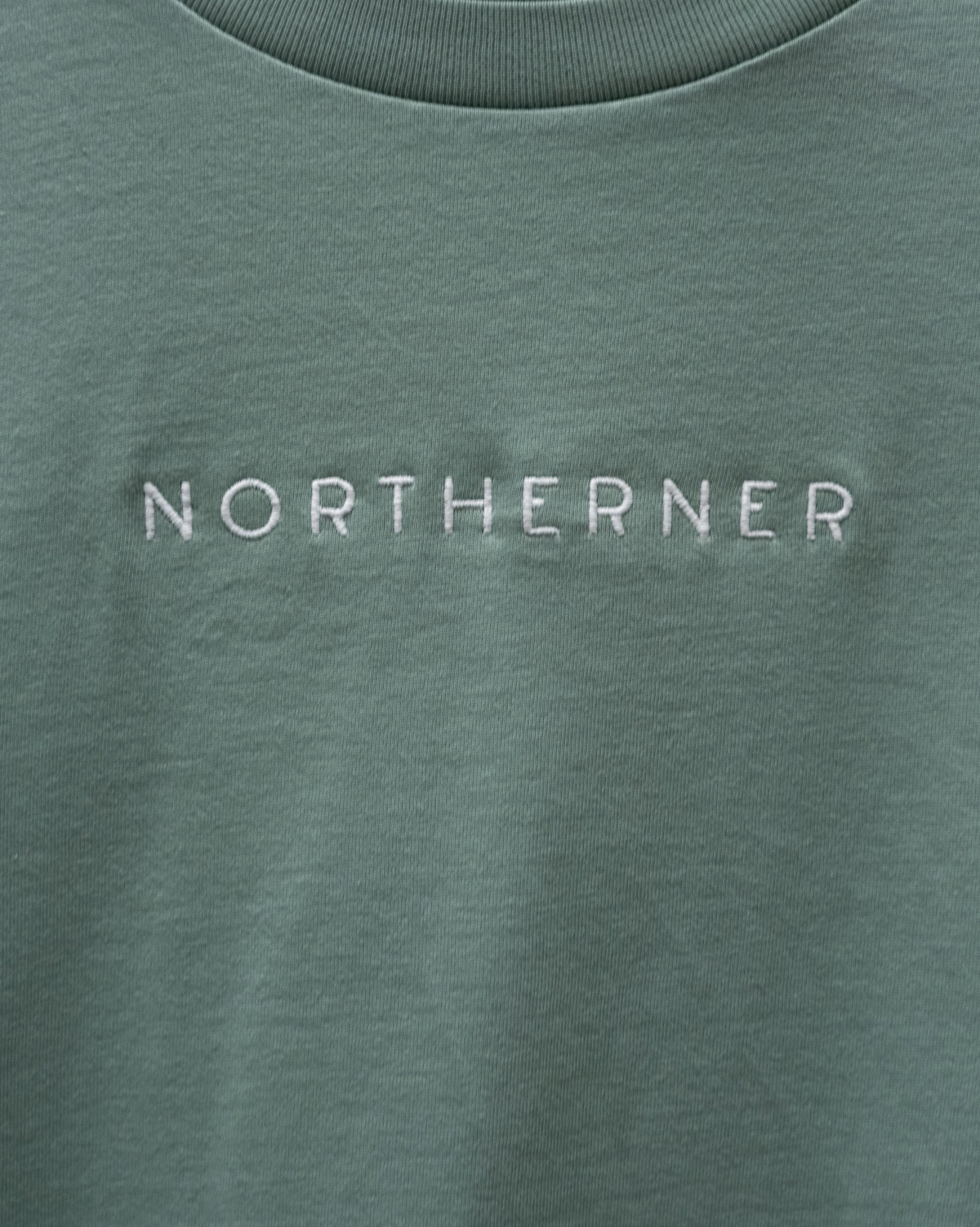 LighthouseLane sage green organic cotton unisex t-shirt featuring Northerner embroidered slogan on the chest