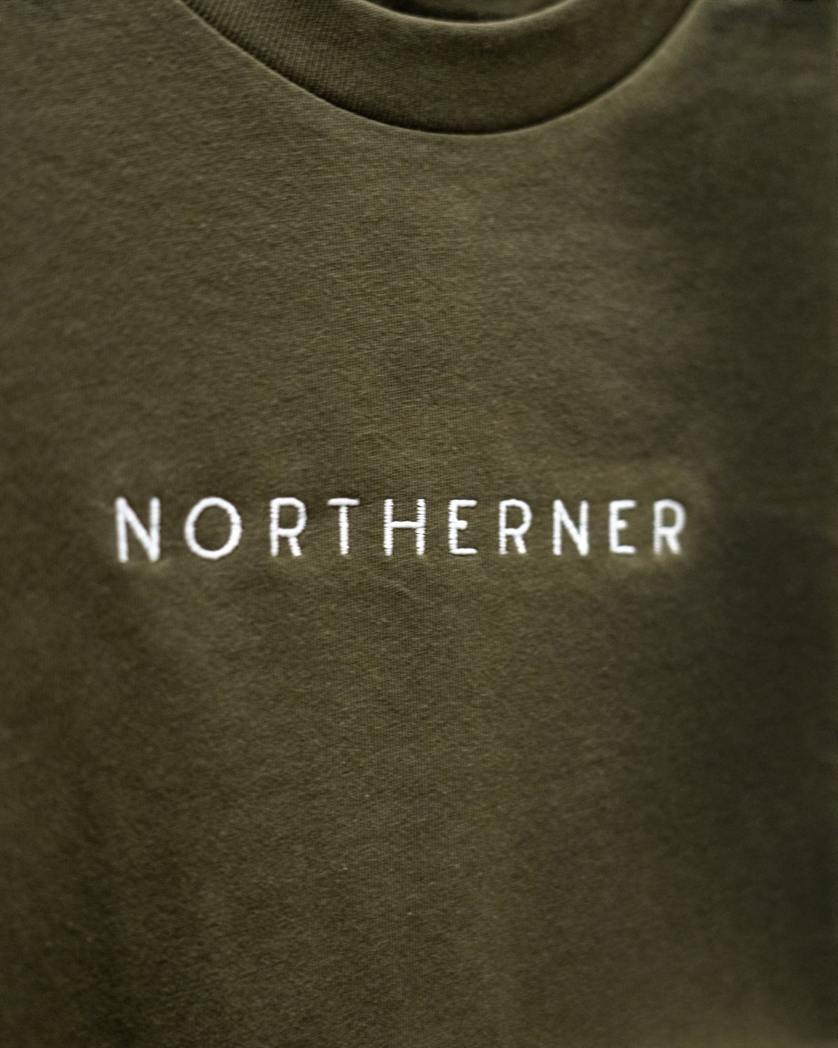 LighthouseLane olive green organic cotton unisex T-shirt with white Northerner embroidered slogan on the chest