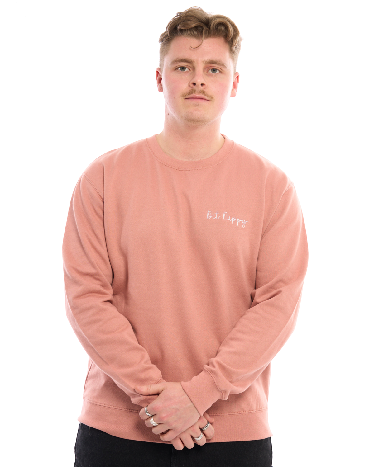 LighthouseLane unisex pink sweatshirt with Bit Nippy embroidered slogan worn by a man against a white background