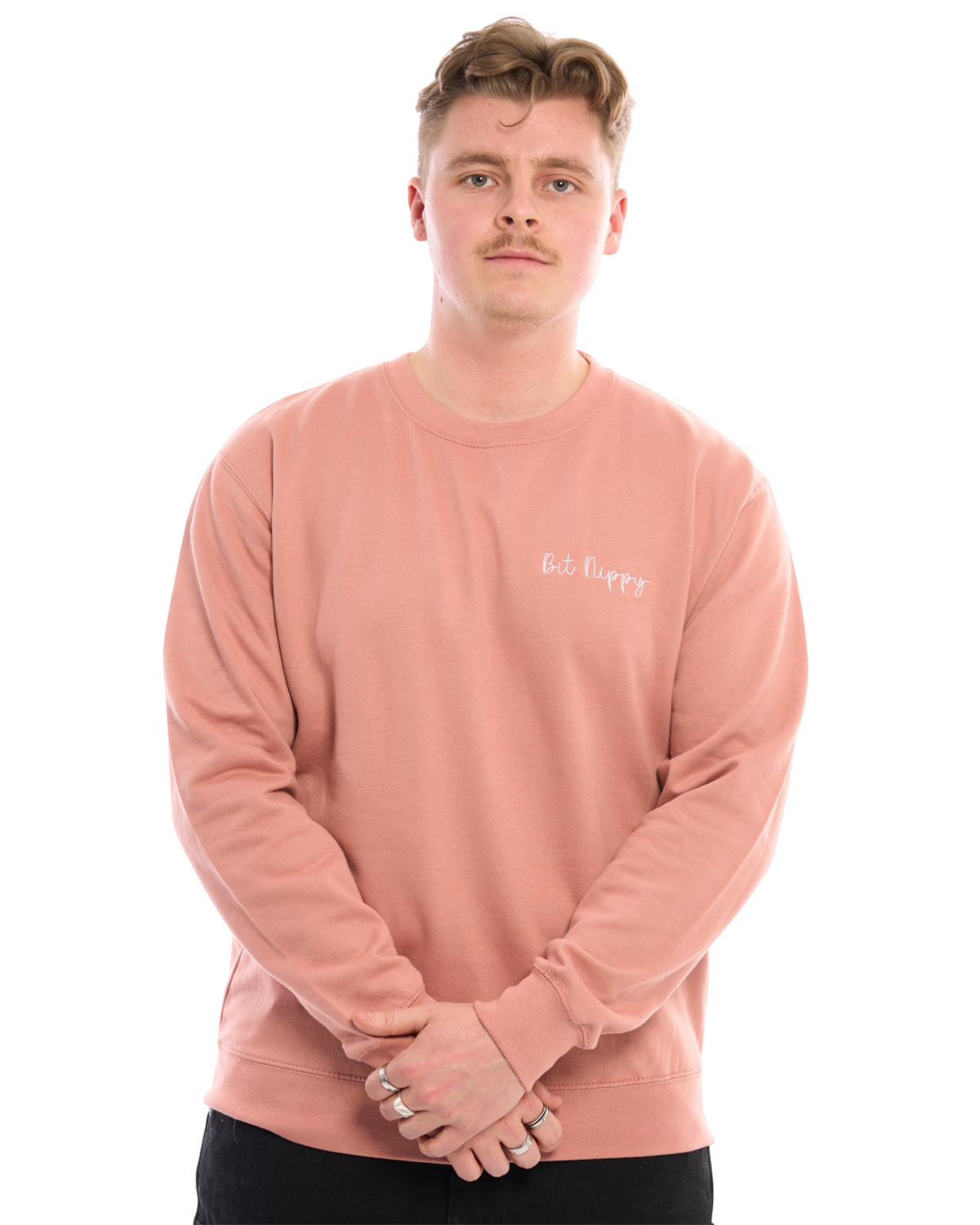 LighthouseLane unisex pink sweatshirt with Bit Nippy embroidered slogan worn by a man against a white background