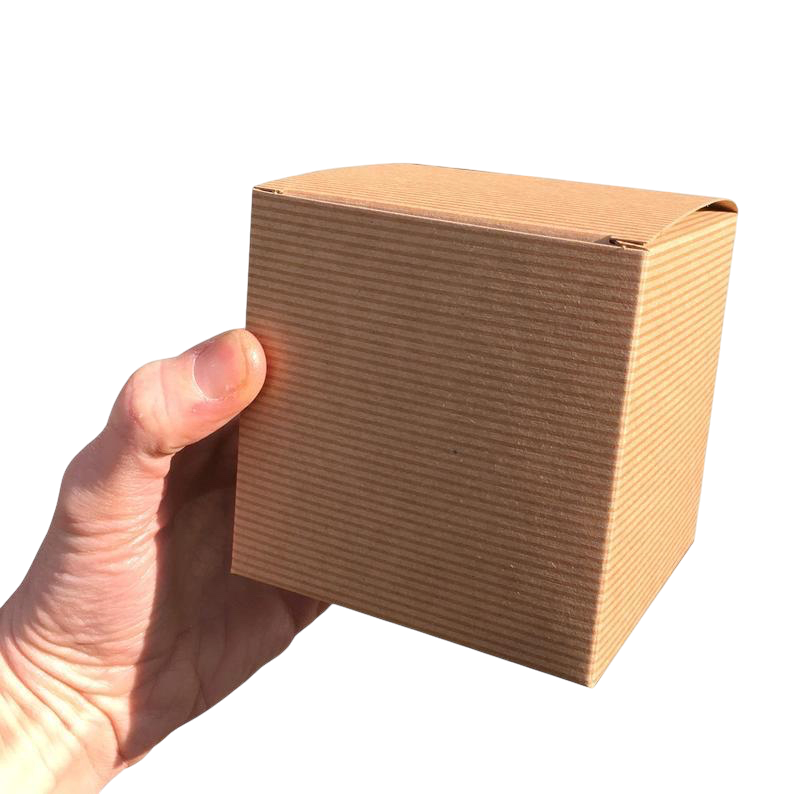 LighthouseLane recycled kraft cardboard gift box for Yorkshire Tube Underground mug held in a hand