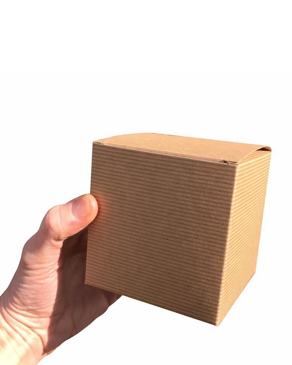 LighthouseLane recycled brown Kraft cardboard gift box for a ceramic mug held in a hand