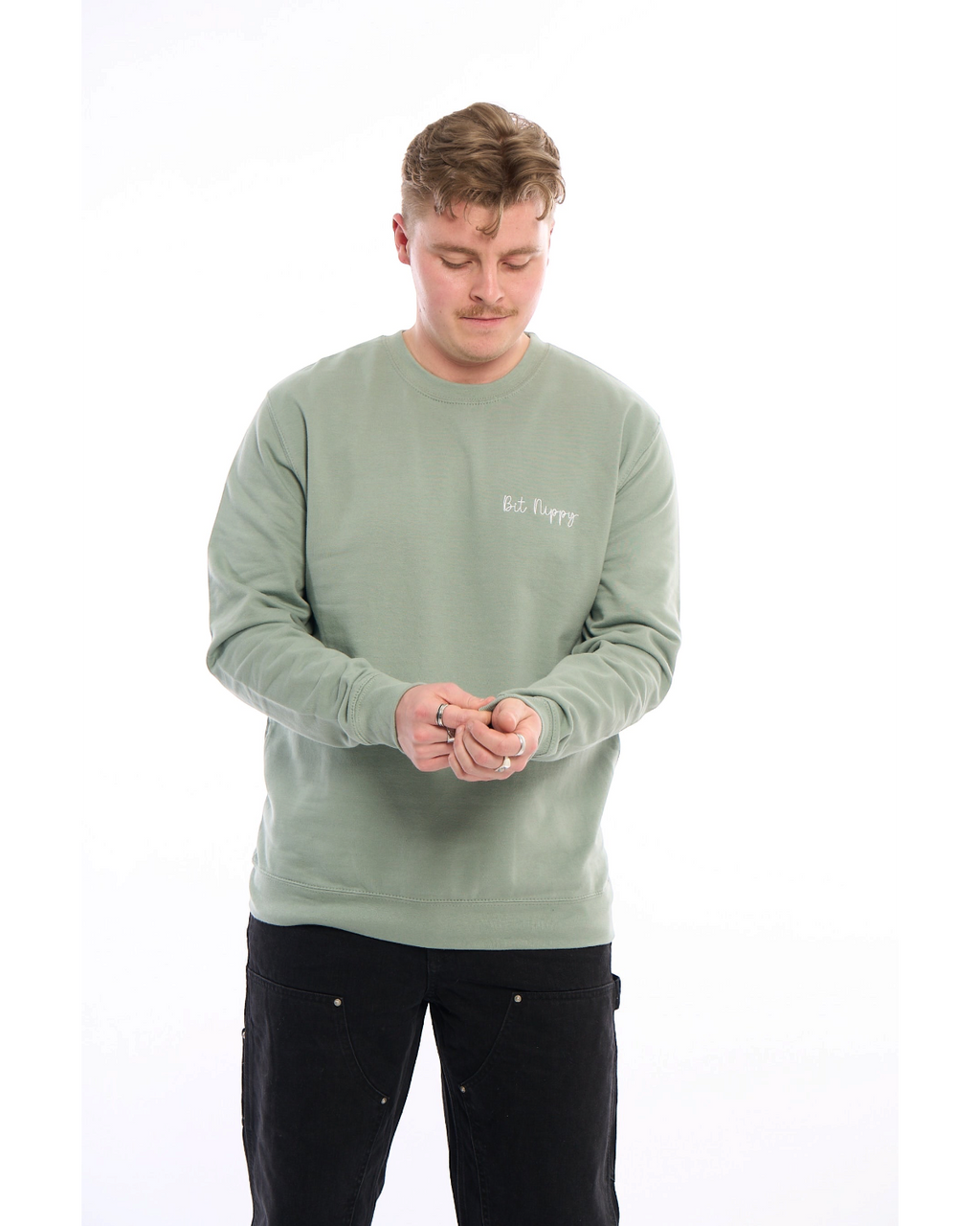 LighthouseLane sage green unisex sweatshirt with Bit Nippy embroidery worn by a man against a white background