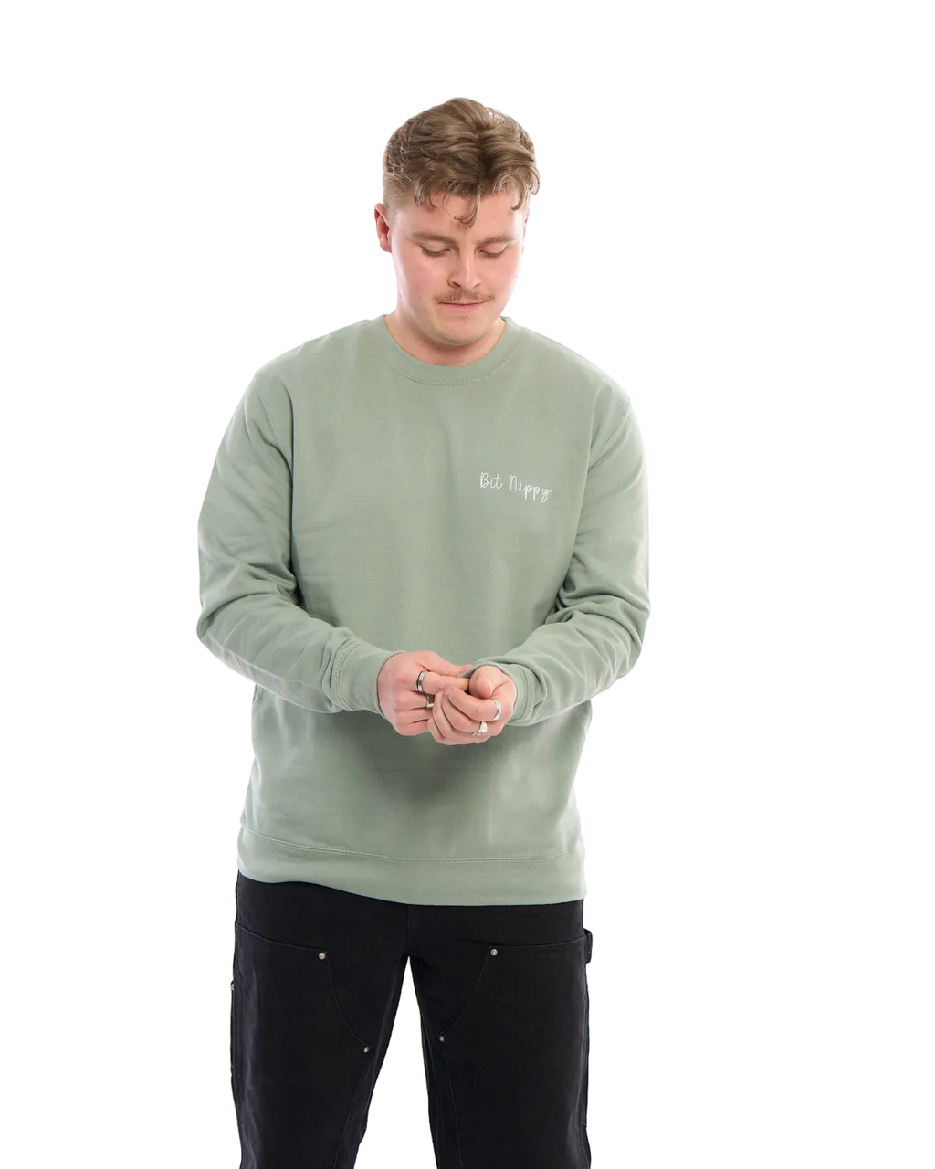 LighthouseLane sage green unisex sweatshirt with Bit Nippy embroidery worn by a man against a white background