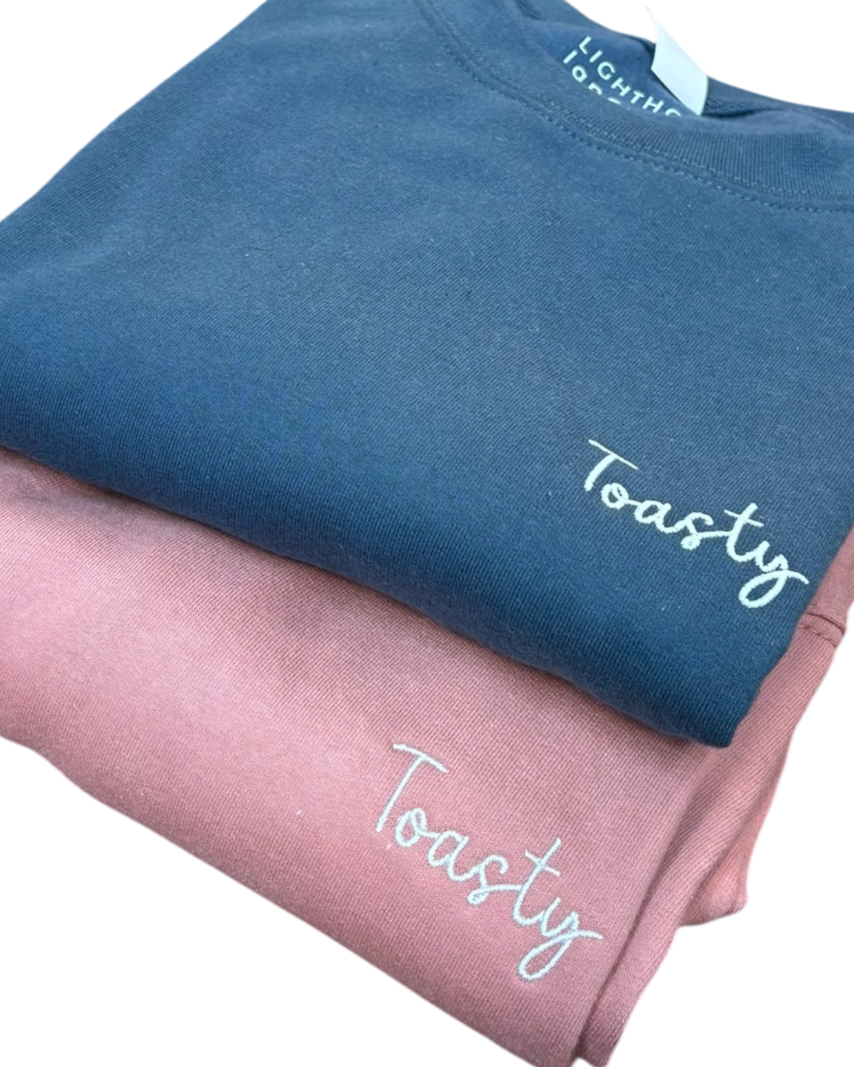 LighthouseLane unisex cotton blend sweatshirts in blue and pink with Toasty embroidered slogan on the chest