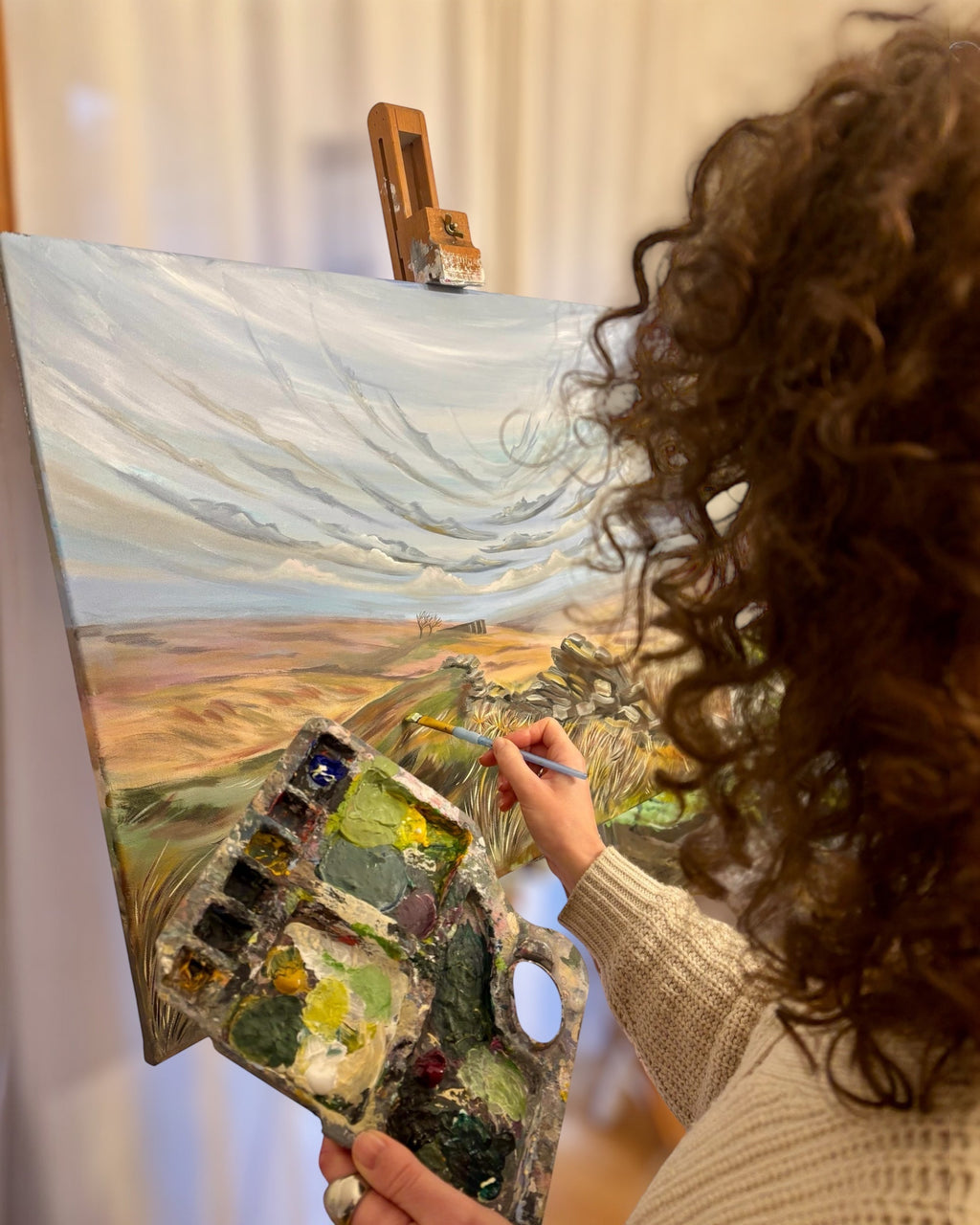 LighthouseLane artist painting a landscape of Top Withens on canvas, inspired by Wuthering Heights in Yorkshire.
