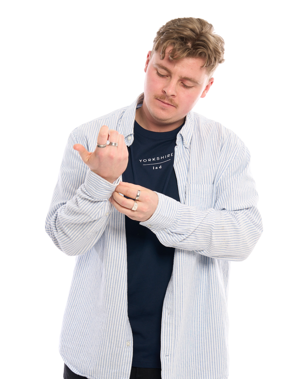 LighthouseLane navy organic cotton T-shirt with Yorkshire Lad embroidery worn under a striped shirt by a man