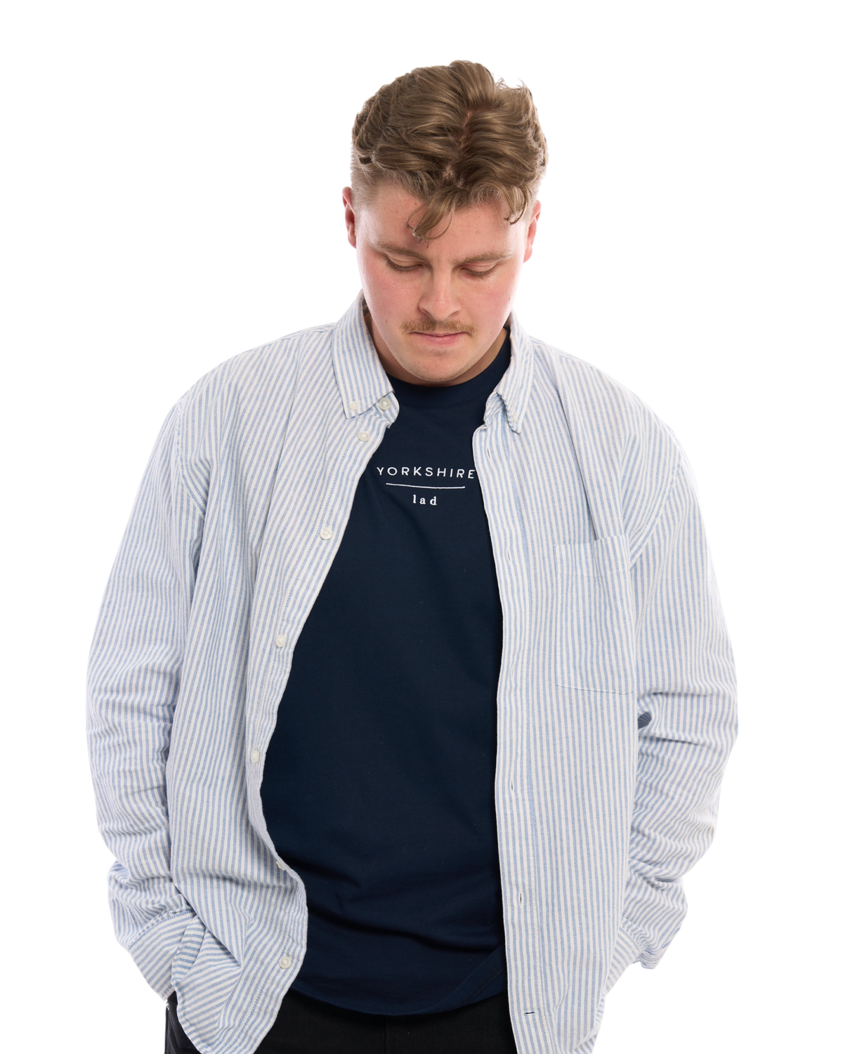 LighthouseLane navy organic cotton T-shirt with Yorkshire Lad embroidery worn by a man in a striped shirt