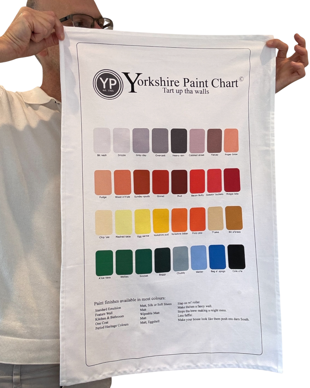 LighthouseLane white cotton tea towel featuring a humorous Yorkshire paint chart with colourful regional shades.