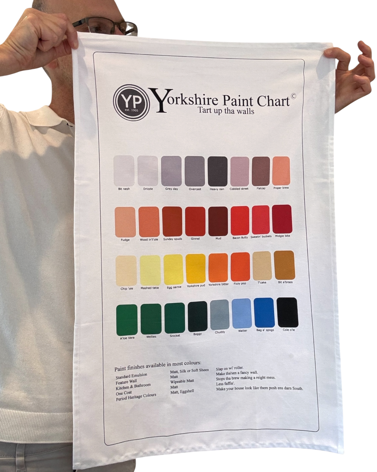 LighthouseLane white cotton tea towel featuring a humorous Yorkshire paint chart with colourful regional shades.